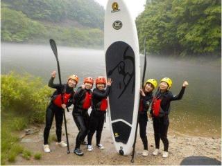 Half-day stand-up paddleboarding experience in Minakami, Gunma, including access to hot springs.